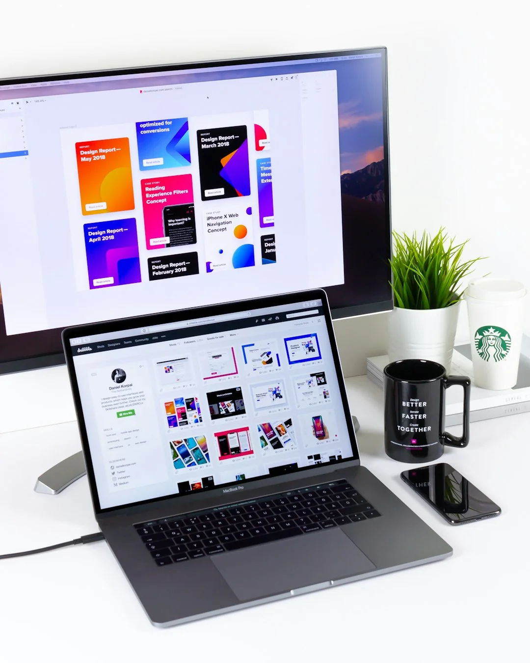 A vibrant workspace featuring a laptop, tablet, and TV with colorful lighting.